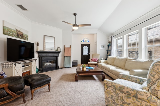 816 Claycourt Cir, Fort Worth, TX 76120 - living area featuring carpet flooring, crown molding, ceiling fan, a fireplace with flush hearth, and vaulted ceiling