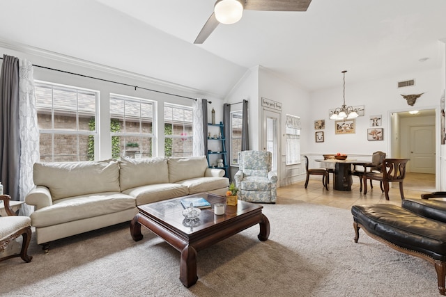 816 Claycourt Cir, Fort Worth, TX 76120 - living room with a chandelier, light colored carpet, a ceiling fan, lofted ceiling, and light tile patterned floors