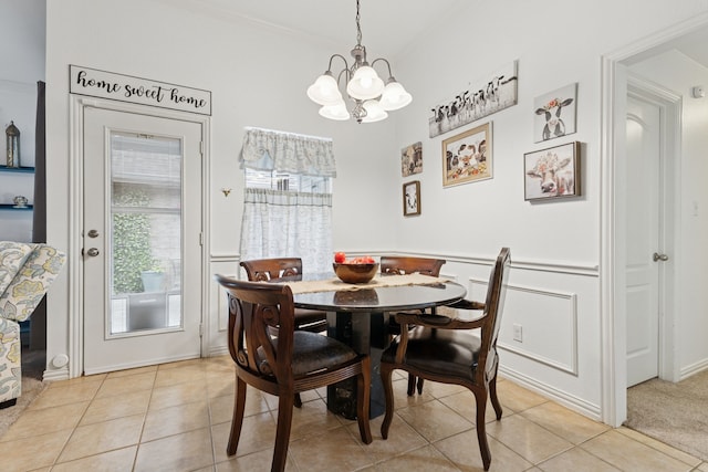 816 Claycourt Cir, Fort Worth, TX 76120 - dining room with a chandelier, light tile patterned floors, and ornamental molding