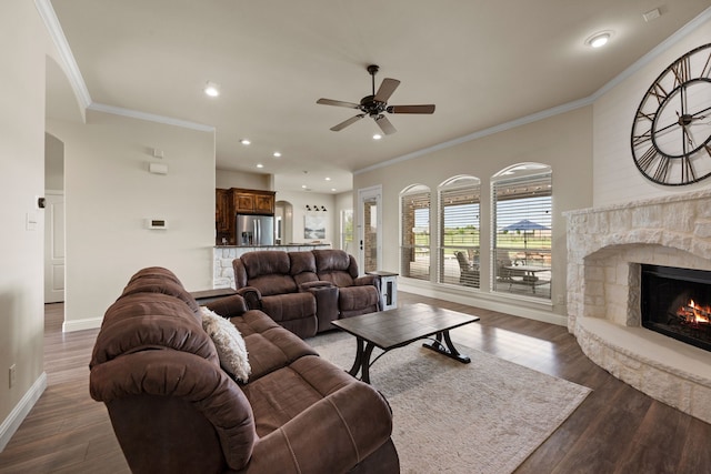 14208 Lucille Dr, Newark, TX 76071 - living room with ceiling fan, baseboards, a fireplace, dark wood-style flooring, and ornamental molding