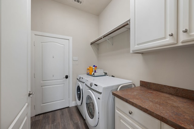 14208 Lucille Dr, Newark, TX 76071 - laundry room featuring separate washer and dryer, dark wood-type flooring, and cabinet space
