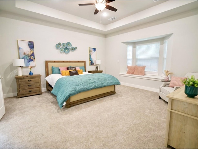 2217 S Peachtree Ct, Denison, TX 75020 - bedroom featuring a raised ceiling, light colored carpet, baseboards, and ceiling fan