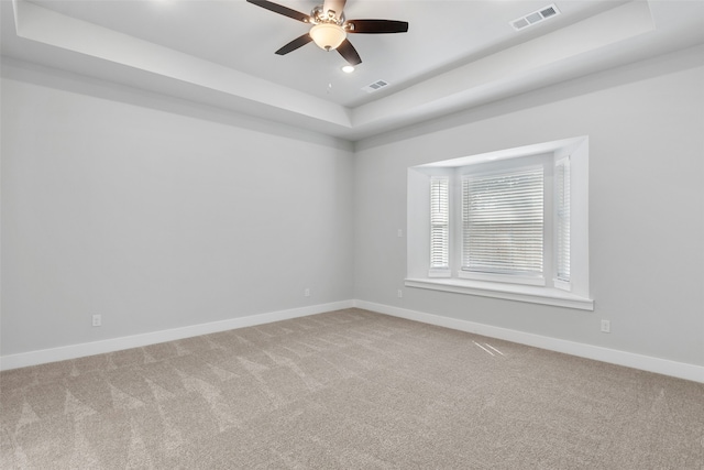 2217 S Peachtree Ct, Denison, TX 75020 - empty room featuring a raised ceiling, light carpet, a ceiling fan, baseboards, and recessed lighting