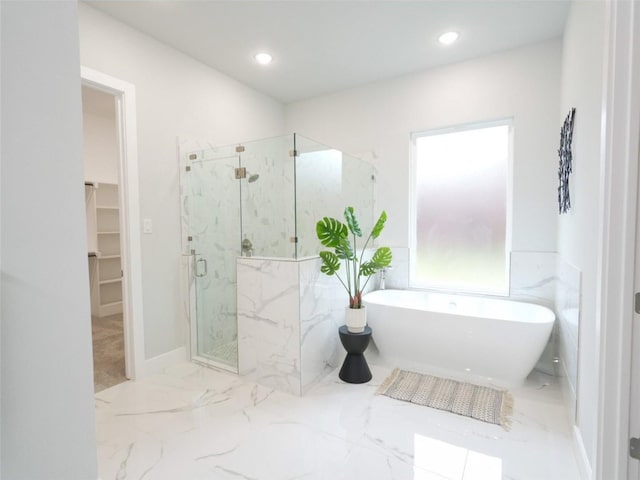 2217 S Peachtree Ct, Denison, TX 75020 - bathroom with a marble finish shower, marble tiled flooring, a freestanding tub, a spacious closet, and recessed lighting