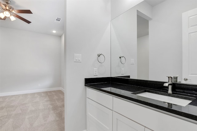 2217 S Peachtree Ct, Denison, TX 75020 - bathroom with double vanity, ceiling fan, baseboards, and recessed lighting