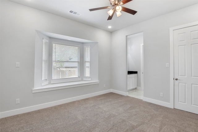 2217 S Peachtree Ct, Denison, TX 75020 - unfurnished bedroom with light carpet, baseboards, connected bathroom, recessed lighting, and a ceiling fan