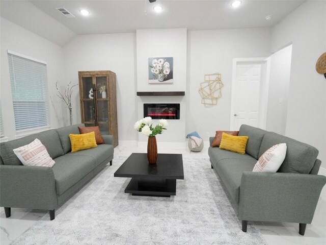 2217 S Peachtree Ct, Denison, TX 75020 - living room featuring a glass covered fireplace, recessed lighting, and vaulted ceiling