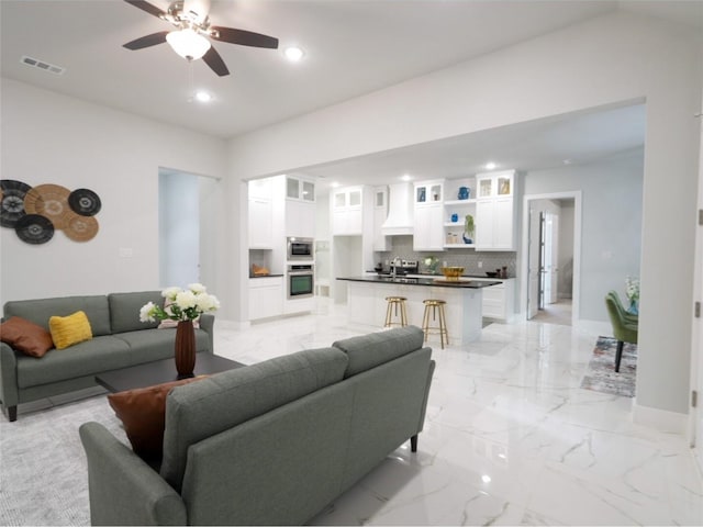 2217 S Peachtree Ct, Denison, TX 75020 - living room featuring recessed lighting, light marble finish floors, a ceiling fan, and baseboards