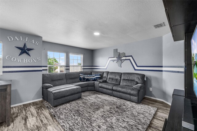 8002 Stowe Springs Ln, Arlington, TX 76002 - living room featuring wood finished floors, a textured ceiling, and baseboards