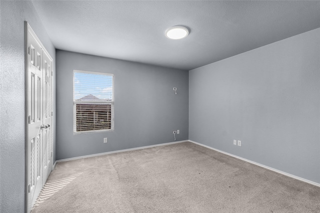8002 Stowe Springs Ln, Arlington, TX 76002 - unfurnished bedroom featuring carpet floors, a closet, and baseboards
