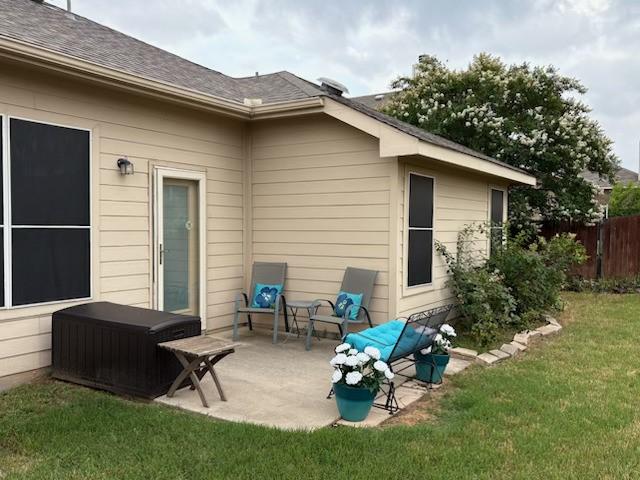 14121 Tanglebrush Trl, Fort Worth, TX 76052 - back of property with a patio and roof with shingles