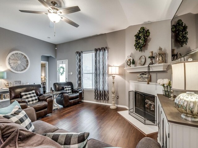 14121 Tanglebrush Trl, Fort Worth, TX 76052 - living room with a tile fireplace, ceiling fan, wood finished floors, and baseboards