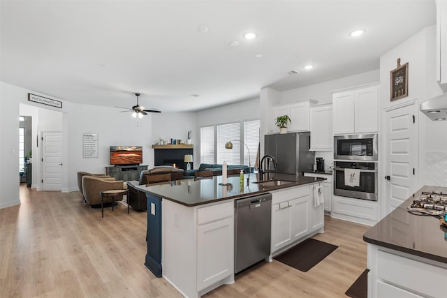 2603 Loxley Dr, Mansfield, TX 76084 - kitchen featuring appliances with stainless steel finishes, dark countertops, a sink, tasteful backsplash, and recessed lighting