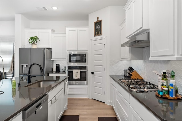 2603 Loxley Dr, Mansfield, TX 76084 - kitchen with stainless steel appliances, exhaust hood, a sink, and white cabinets