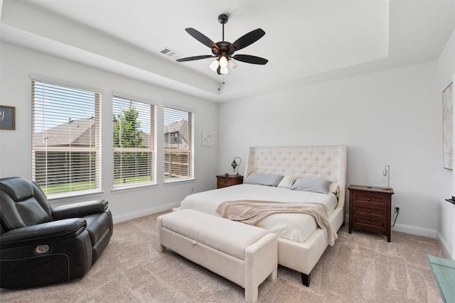 2603 Loxley Dr, Mansfield, TX 76084 - bedroom featuring baseboards, light colored carpet, a tray ceiling, and a ceiling fan