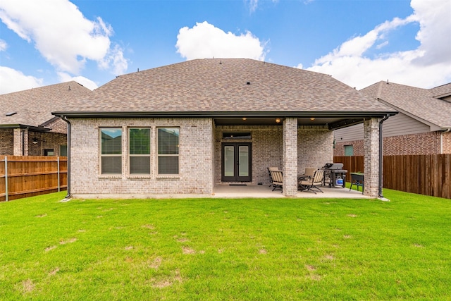 2603 Loxley Dr, Mansfield, TX 76084 - rear view of property featuring brick siding, roof with shingles, and a patio area