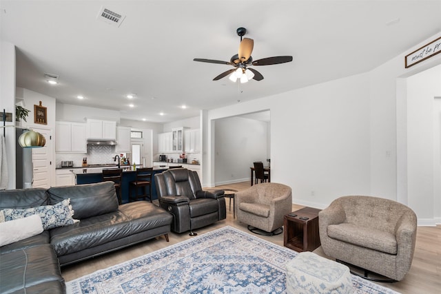 2603 Loxley Dr, Mansfield, TX 76084 - living area featuring light wood-type flooring, ceiling fan, recessed lighting, and baseboards