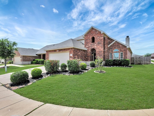 4013 Vista Greens Dr, Fort Worth, TX 76244 - traditional home with brick siding, an attached garage, a chimney, and concrete driveway