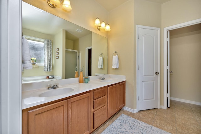 4013 Vista Greens Dr, Fort Worth, TX 76244 - bathroom featuring double vanity, a stall shower, baseboards, and tile patterned floors