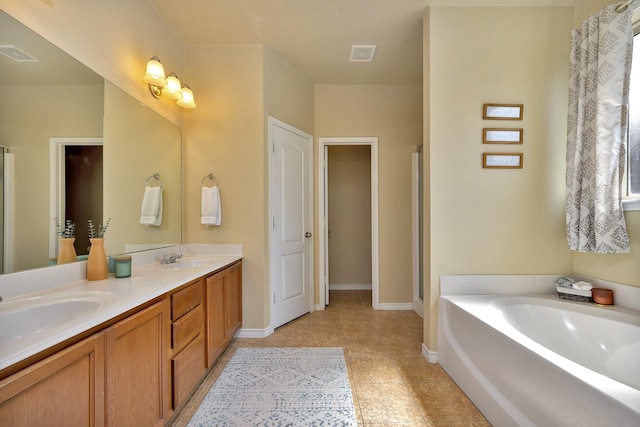 4013 Vista Greens Dr, Fort Worth, TX 76244 - full bath featuring double vanity, a garden tub, a shower stall, and baseboards