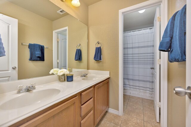 4013 Vista Greens Dr, Fort Worth, TX 76244 - bathroom featuring double vanity, tile patterned flooring, and baseboards