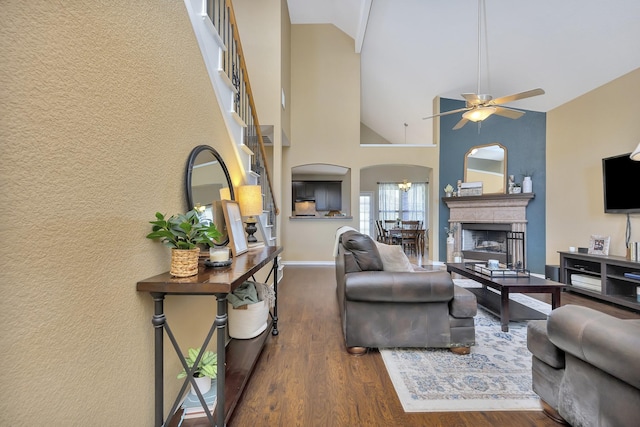 4013 Vista Greens Dr, Fort Worth, TX 76244 - living room with wood finished floors, a ceiling fan, arched walkways, baseboards, and a textured wall