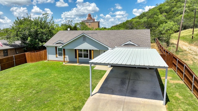 209 NE 6th Ave, Mineral Wells, TX 76067 - view of front of home featuring driveway, a carport, and roof with shingles