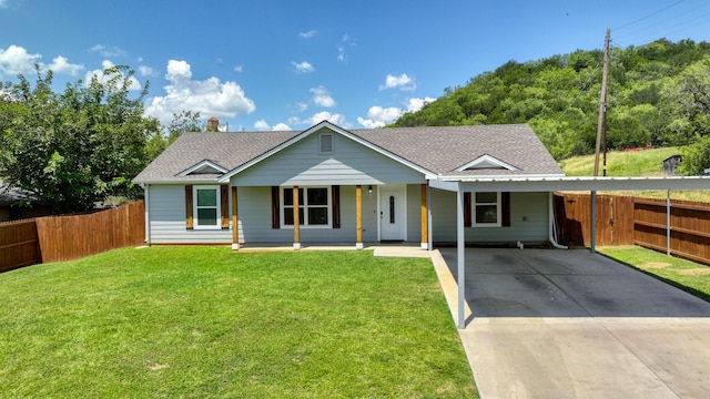209 NE 6th Ave, Mineral Wells, TX 76067 - ranch-style house with concrete driveway, an attached carport, roof with shingles, and covered porch