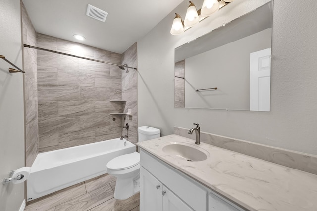 209 NE 6th Ave, Mineral Wells, TX 76067 - bathroom with vanity, toilet, and shower / washtub combination