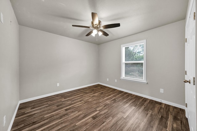 209 NE 6th Ave, Mineral Wells, TX 76067 - unfurnished room featuring dark wood finished floors, baseboards, and ceiling fan