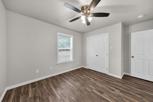 209 NE 6th Ave, Mineral Wells, TX 76067 - unfurnished bedroom with dark wood-style flooring, baseboards, a closet, and ceiling fan