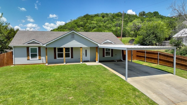 209 NE 6th Ave, Mineral Wells, TX 76067 - ranch-style house featuring a shingled roof, concrete driveway, an attached carport, and a porch