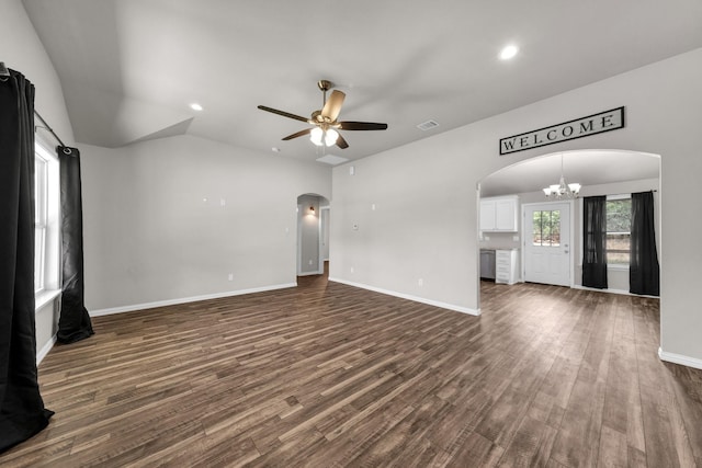 209 NE 6th Ave, Mineral Wells, TX 76067 - unfurnished living room with arched walkways, a chandelier, ceiling fan, dark wood-style floors, and recessed lighting