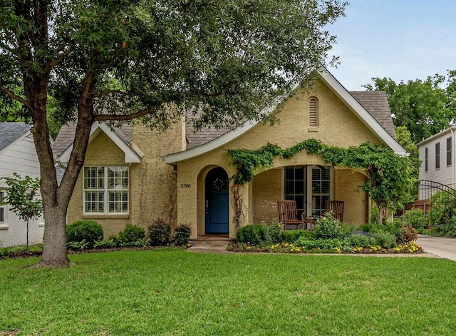 3766 W 4th St, Fort Worth, TX 76107 - tudor home featuring a front lawn and a porch