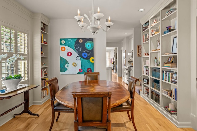 3766 W 4th St, Fort Worth, TX 76107 - dining room featuring light wood-style floors, a chandelier, built in shelves, and baseboards