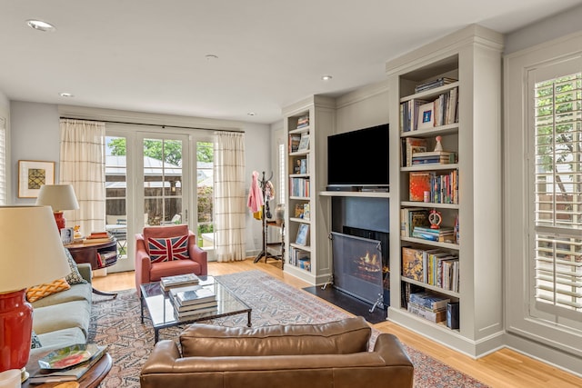 3766 W 4th St, Fort Worth, TX 76107 - living room with healthy amount of natural light, a fireplace with flush hearth, wood finished floors, and recessed lighting
