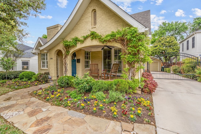 3766 W 4th St, Fort Worth, TX 76107 - view of front of property with a gate, a chimney, covered porch, a shingled roof, and driveway