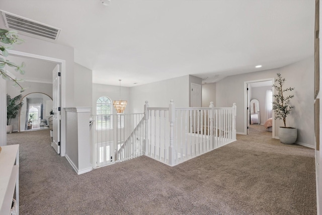 7205 Fair Valley Way, Plano, TX 75024 - hall with carpet, an upstairs landing, and a chandelier