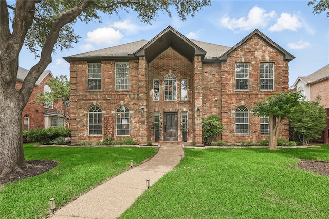 7205 Fair Valley Way, Plano, TX 75024 - colonial inspired home with a front yard and brick siding