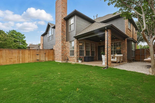 7205 Fair Valley Way, Plano, TX 75024 - rear view of house featuring a chimney, a patio area, brick siding, and a gate