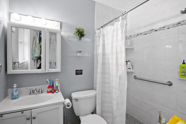 31 W Townhouse Ln Unit 20, Grand Prairie, TX 75052 - bathroom with vanity, toilet, and a tile shower
