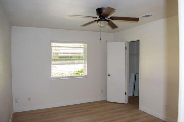 731 E Cherry St, Duncanville, TX 75116 - unfurnished room with wood finished floors, ceiling fan, and baseboards
