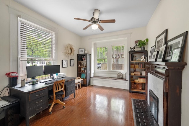 100 Corsicana St, Hillsboro, TX 76645 - office space with a ceiling fan, wood-type flooring, and a tile fireplace
