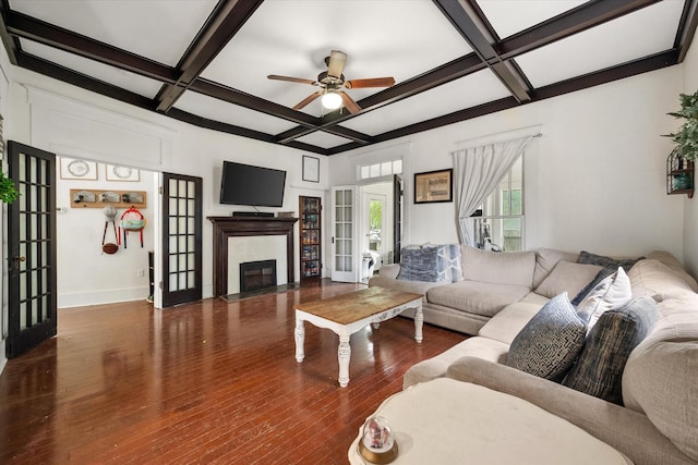 100 Corsicana St, Hillsboro, TX 76645 - living room with coffered ceiling, french doors, a ceiling fan, hardwood / wood-style flooring, and beam ceiling
