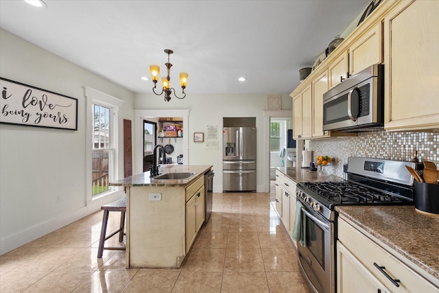 100 Corsicana St, Hillsboro, TX 76645 - kitchen featuring appliances with stainless steel finishes, a sink, a chandelier, plenty of natural light, and recessed lighting