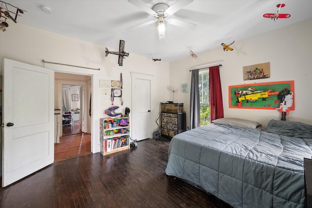 100 Corsicana St, Hillsboro, TX 76645 - bedroom with wood finished floors and ceiling fan