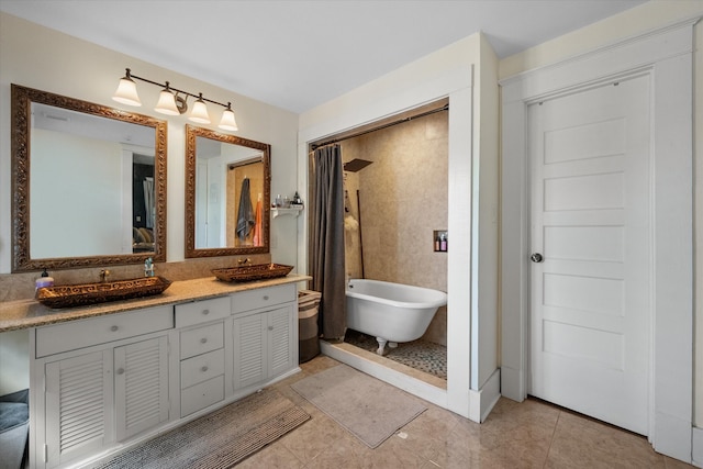 100 Corsicana St, Hillsboro, TX 76645 - full bath with a freestanding tub, vanity, tile patterned flooring, and a shower with shower curtain