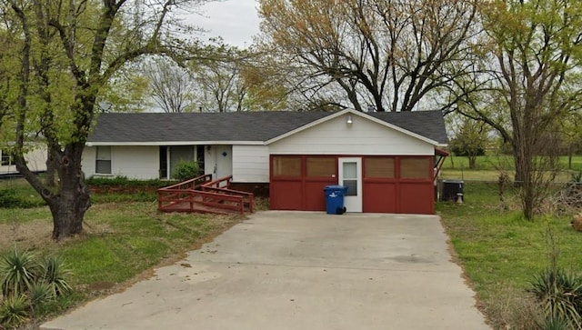 401 Frisco St, Cumby, TX 75433 - ranch-style house featuring concrete driveway and central AC unit