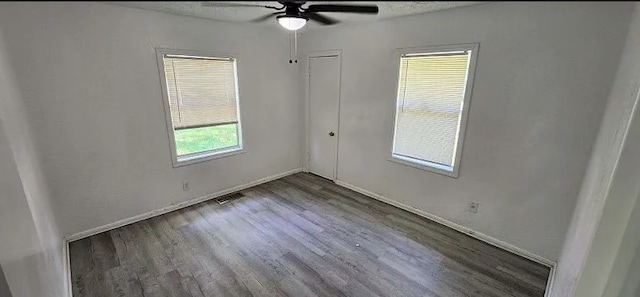 401 Frisco St, Cumby, TX 75433 - empty room featuring wood finished floors, ceiling fan, and baseboards