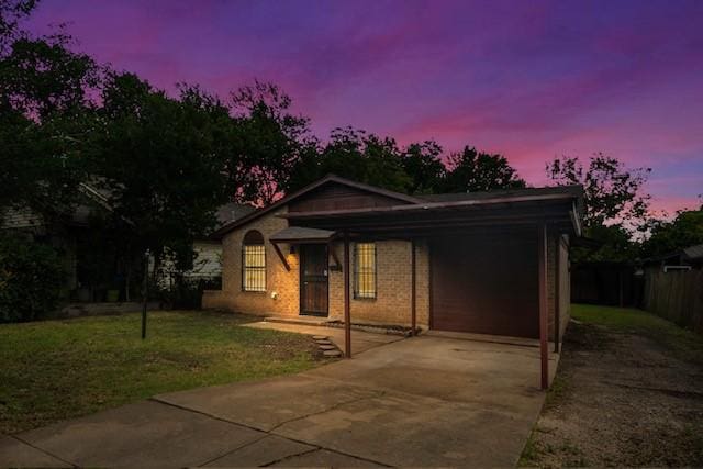 3406 Schwartz Ave, Fort Worth, TX 76106 - ranch-style home with concrete driveway, a front lawn, an attached carport, and brick siding